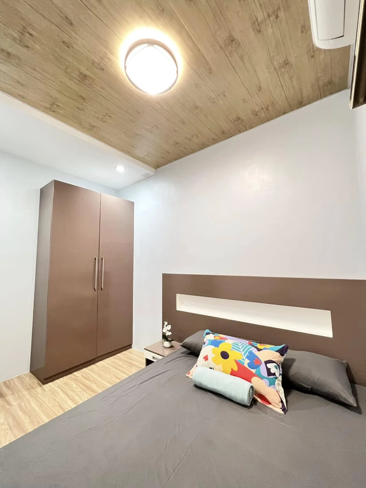 Bedroom with grey bedding